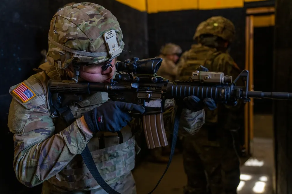 U.S. Army personnel practicing movement through an indoor shoot house